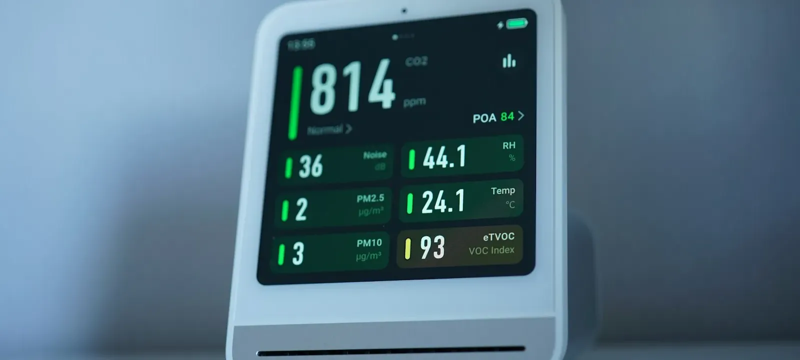 Air quality monitor displaying particulate readings