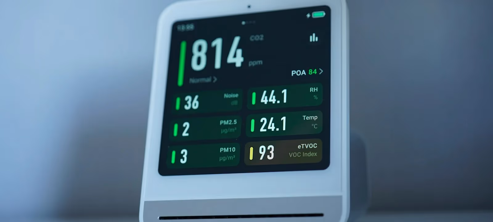 Air quality monitor displaying particulate readings
